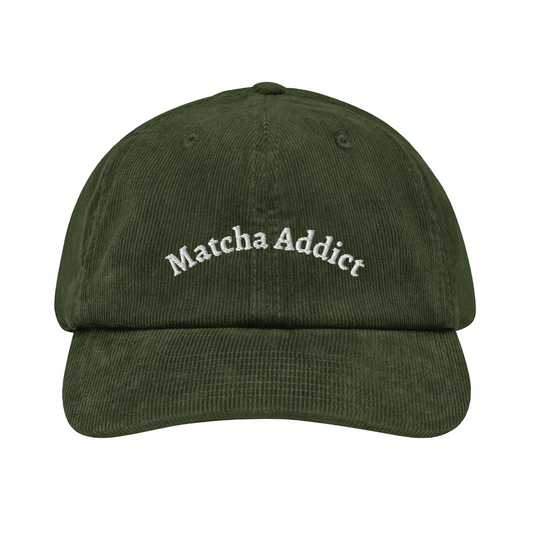 Green cap with 'Matcha Addict' text on a white background