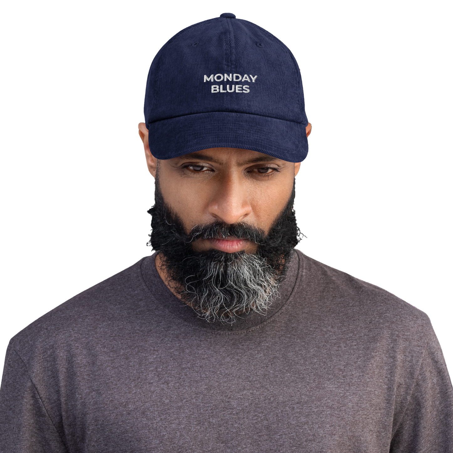 Man wearing a navy cap with 'MONDAY BLUES' text on a white background
