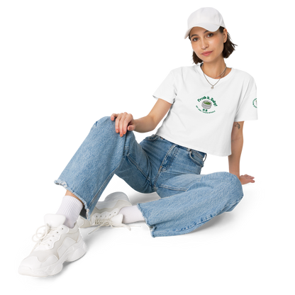 Person wearing a white t-shirt, blue jeans, and white sneakers on a white background